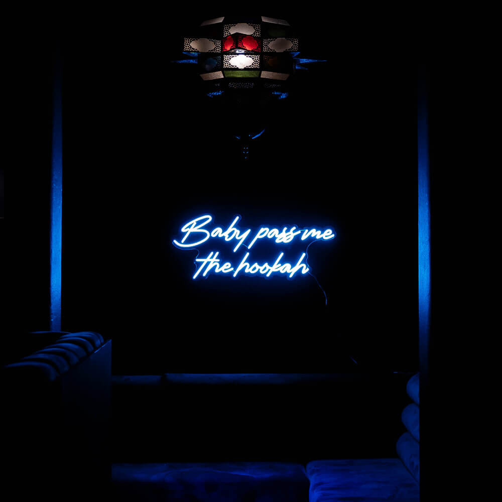 blue baby pass me the hookah neon sign hanging on shisha bar wall