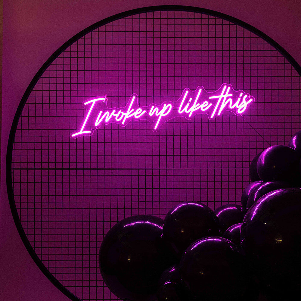hot pink I woke up like this neon sign hire on black mesh backdrop frame
